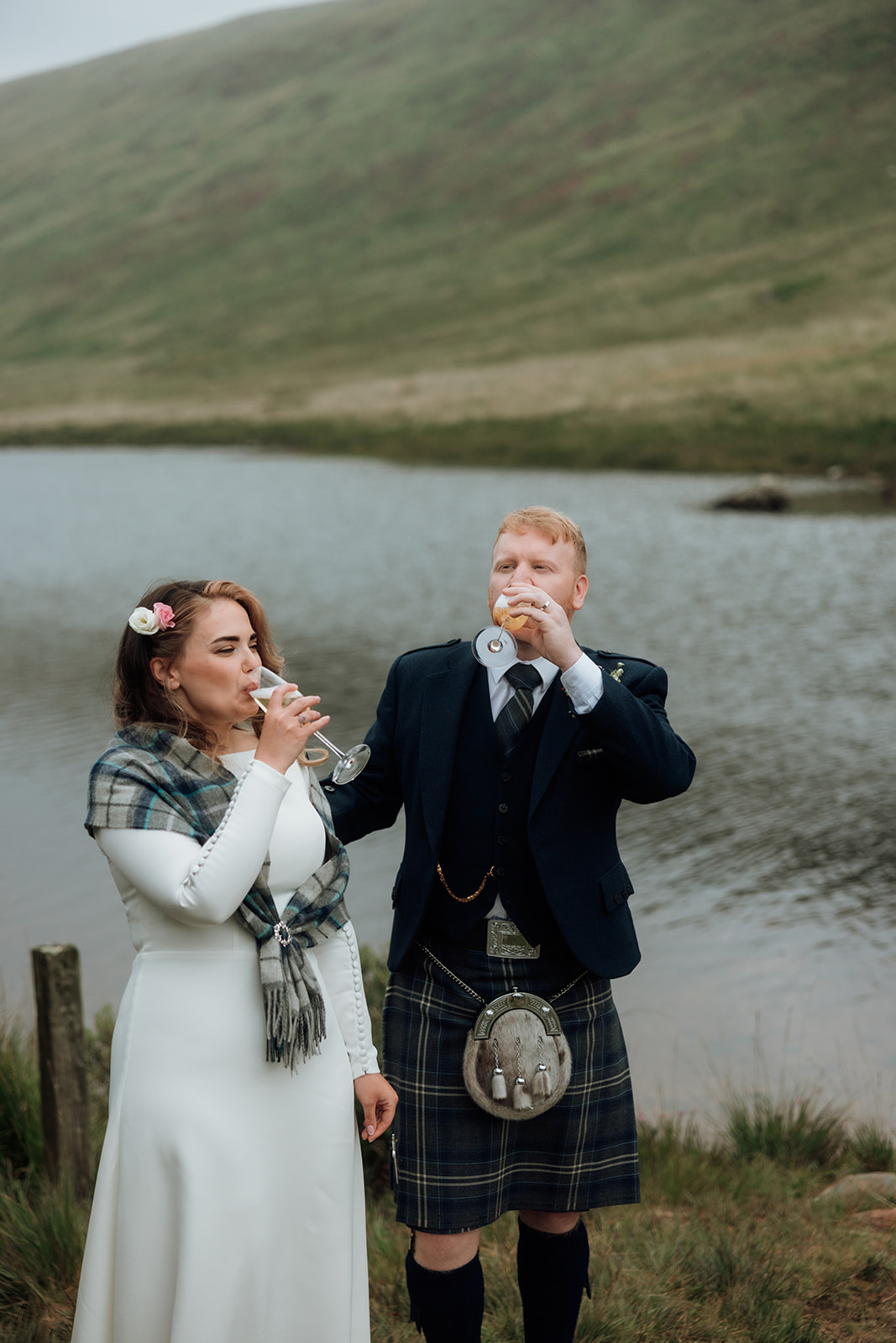 Bride drinking champagne during Isle of Arran elopement.