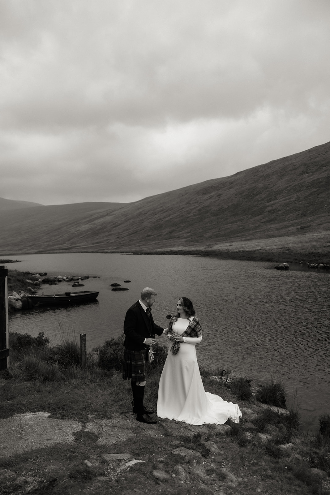 Black and white photo of couple standing together by Loch Iorsa, Isle of Arran.