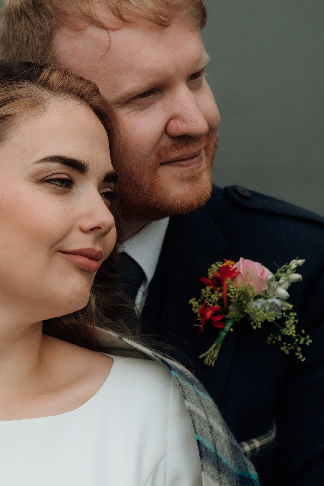 Close-up of bride and groom standing together during Isle of Arran elopement.