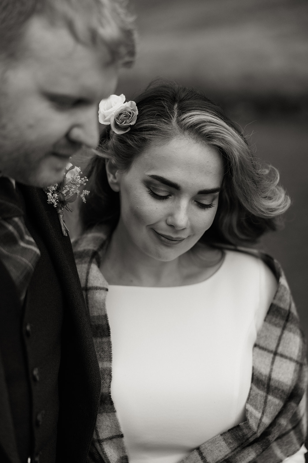 Close-up of bride looking down with groom beside her during Isle of Arran elopement.